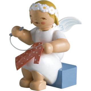 Marguerite angel, sitting, with needle and thread