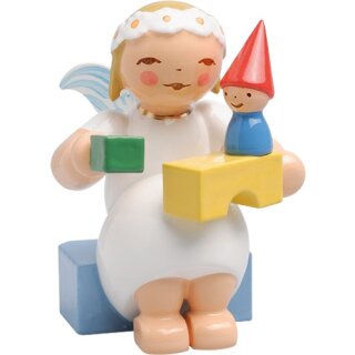 Marguerite angel, sitting, with building blocks
